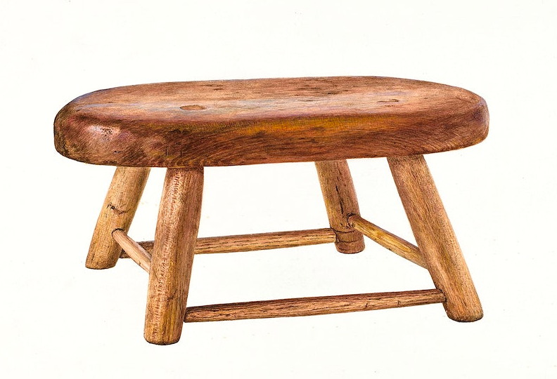 a wooden milking bench