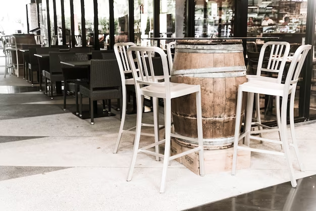 Several white bar stools in a cafe