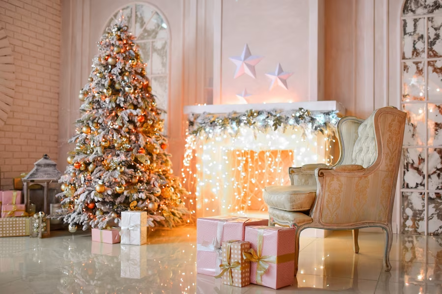 The room is decorated in pink and gold colors