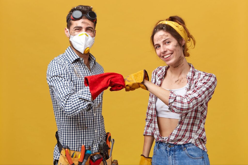 Young happy couple doing house renovation